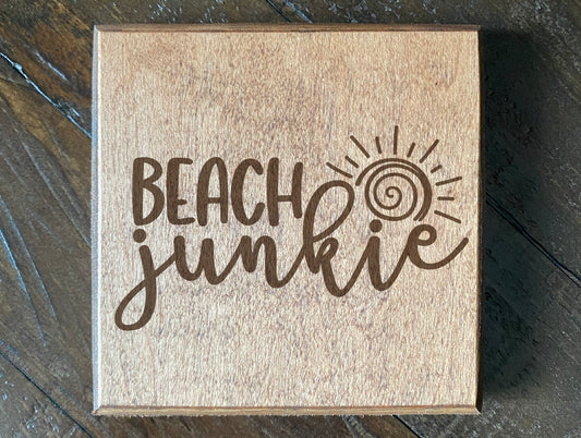 Set of four wood burned coasters with (Beach junkie).