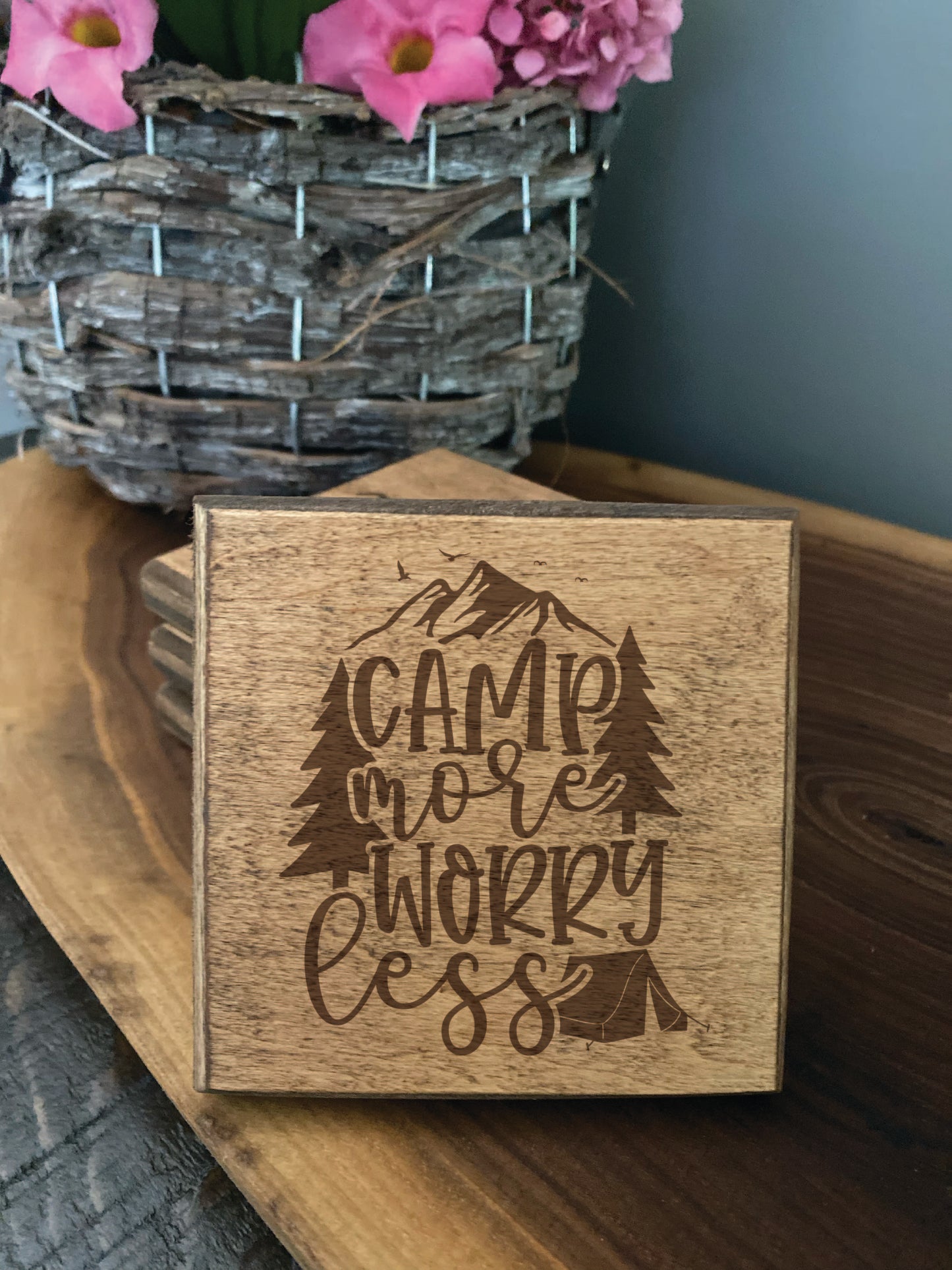 Set of four wood burned coasters with (Camp more worry less).Handcrafted with a rustic design.