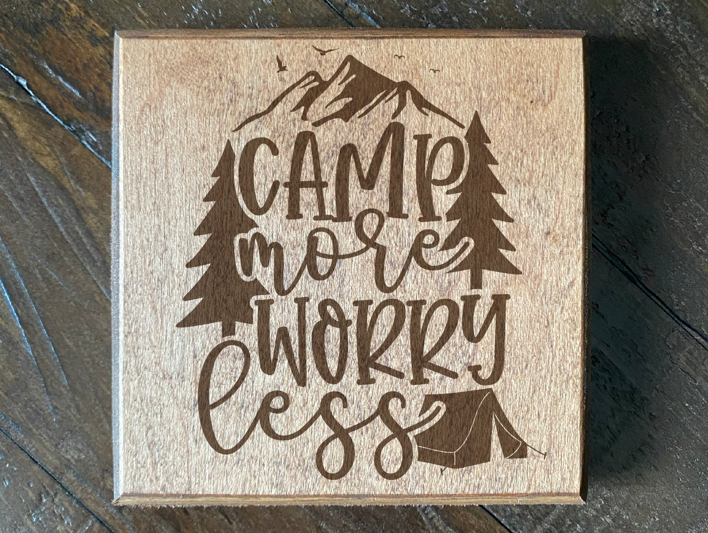 Set of four wood burned coasters with (Camp more worry less).Handcrafted with a rustic design.