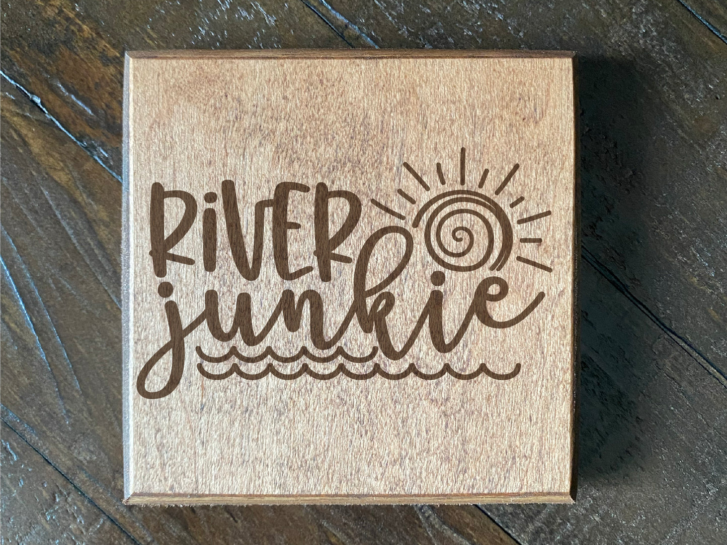 Set of four wood burned coasters with (River junkie).