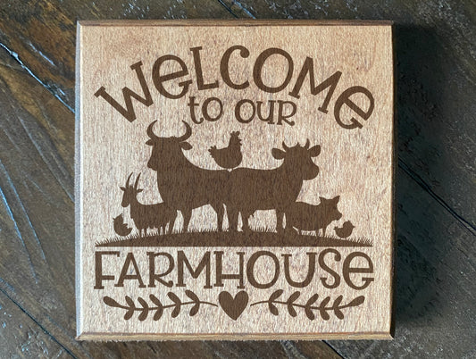 Set of four wood burned coasters with (Welcome to our farm house).